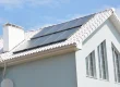 an energy efficient house with solar panels on the roof