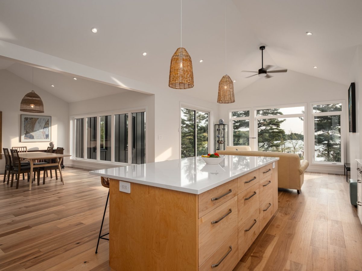 kitchen view with large oak and White Island - Photo from our custom home built project - Loughborough Lake New Home Build in South Frontenac, Ontario custom home
