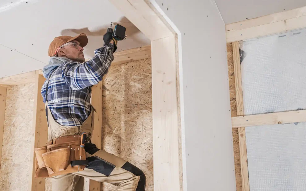 contractor working on a ceiling during renovations