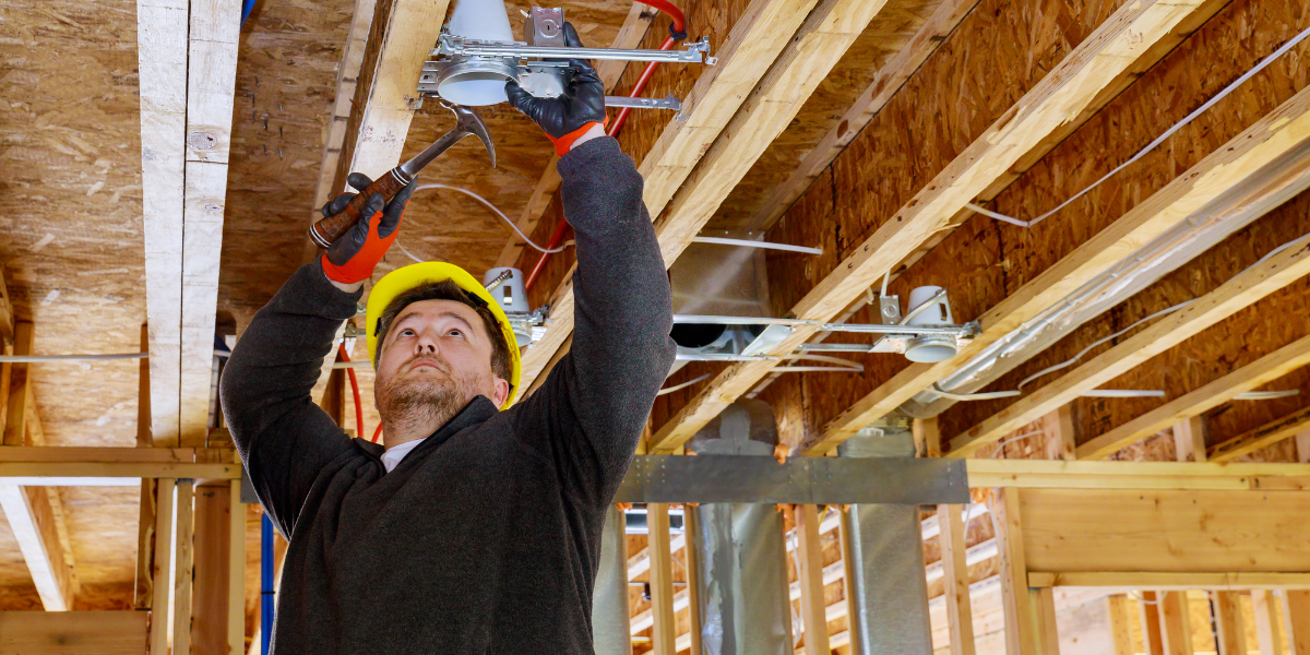 contractor fixing the electrical space and wiring for lighting