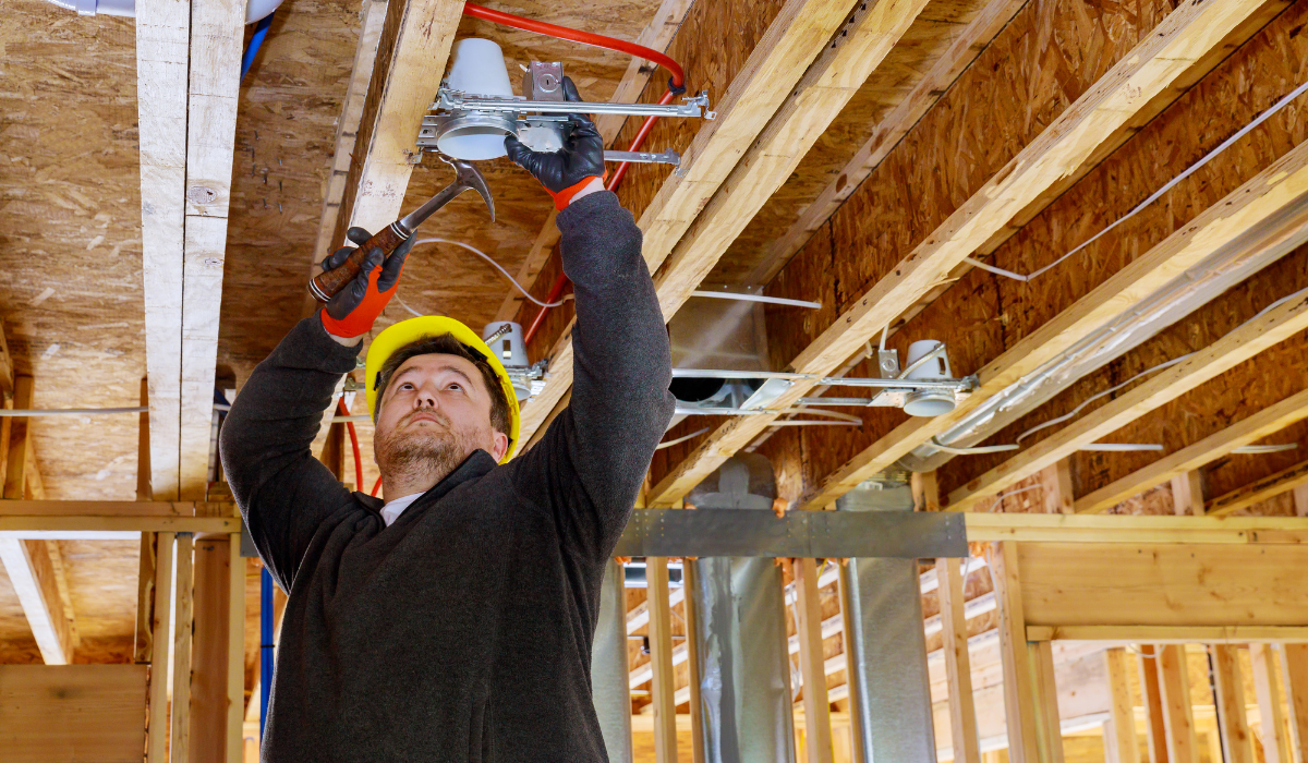 contractor fixing the electrical space and wiring for lighting